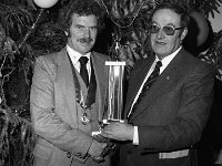 Swinford GAA Dinner, December 1979. - Lyons0012224.jpg  Swinford GAA Dinner, December 1979. Cllr John Bollingbrook at the right presenting trophy to club chairman. : 19791230 Swinford GAA Dinner  2.tif, GAA Functions, Lyons collection, Swinford GAA