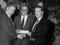 Swinford GAA Dinner, December 1979. - Lyons0012226.jpg  Swinford GAA Dinner, December 1979. Cheque presentation by Sean Colleary TD to Tommy O@ Malley. Centre Cllr John Bollingbrook. : 19791230 Swinford GAA Dinner  4.tif, GAA Functions, Lyons collection, Swinford GAA