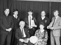 Westport GAA Awards, December 1986 - Lyons0011721.jpg  Westport GAA Awards, December 1986.  Front row : sitting Joe Joyce who got a special award for hid dedication to GAA. His wife Mary sitting next to him.  Back row : Fr Noel Forde, M Brady, J Moran, Chris Grady & Tony O' Keefe. : 19861218 GAA Awards 3.tif, GAA, Lyons collection, Westport