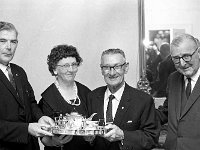 Retirement Function for Court Clerk - Lyons0017482.jpg  Retirement dinner for Mr McFadden court clerk. At left Garda Chief Superintendent making a presentation to Mr and Mrs Michael McFadden retiring district court clerk. At right district judge Hugh McGahan. : 197209 Retirement Function for Court Clerk 2.tif, Achill, Lyons collection