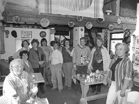 Achill crafts "Cowshed" - Lyons0017705.jpg  Achill crafts "Cowshed" for the Mayo News, Seated in front are the proprietors. Standing at the back French visitors to the Craft Shop. May 1984. : 19840502 Achill Crafts.tif, Achill, Lyons collection