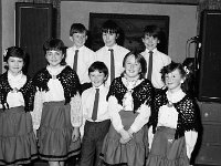 New year party in the Way Inn, Achill, January 1986.. - Lyons0017728.jpg  Tonragee Senior Citizens part in the Way Inn Achill., January 1986. Junior Set Dancers, winners of various prizes and A Cup in Scor na nOg in 1987 were adjudged the best entertainers at the tonragee Community's "New Year Party".   Front row (l. to r.) :Sandra Campbell, Fiona Mc Ginty, Michael John McNamara, Tracey McNamara and Christina Graven.  Back row (l. to r.): Frankie Gavin, Seamus and  Michael Cooney. Tonragee Senior Citizens part in the Way Inn Achill., January 1986. Junior Set Dancers, winners of various prizes and A Cup in Scor na nOg in 1987 were adjudged the best entertainers at the tonragee Community's "New Year Party".  Front row (l. to r.) :Sandra Campbell, Fiona Mc Ginty, Michael John McNamara, Tracey McNamara and Christina Graven. Back row (l. to r.): Frankie Gavin, Seamus and  Michael Cooney. : 19870105 New year party in the Way Inn 4.tif, Achill, Lyons collection