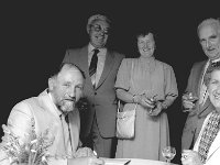 Launching of his book "Apparitions" by Noel Scanlon in Achill - Lyons0017753.jpg  Launching of his book "Apparitions" by Noel Scanlon in Achill. Noel Scanlon signing his books at the launch of his book Apparations. L-R (standing) Mr and Mrs Michael O' Malley, Keel Post Office and Mr Mc Dowell and Vi Mc Dowell Hotel owners in Doogart. : 19890426 Launching of book 1.tif, Achill, Lyons collection