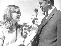 Ballina Festival, July 1969. - Lyons0017195.jpg  Young lady selling a ticket to Eamon Horkan Guinness representative sponsors of Ballina Festival, July 1969. : 19690713 Ballina Festival 7.tif, Ballina, Farmers Journal, Lyons collection