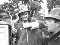 Ballinrobe fire brigade, July 1970. - Lyons0016866.jpg  Fire chief talking to one of his men. Ballinrobe fire brigade, July 1970. : 19700716 Ballinrobe Fire Brigade 1.tif, Ballinrobe, Farmers Journal, Lyons collection