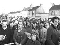 Santa arrives in Ballinrobe 1970 - Lyons0016893.jpg  Santa arrives in Ballinrobe at the invitation of O' Connors' bakery, December 1970. Convent girls choir sing a welcome to Santa Claus. : 1970 Misc, 19701220 Santa arrives in Ballinrobe at the invitation of O' Connors' bakery 7.tif, Ballinrobe, Lyons collection