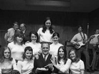 Opening of Ballinrobe festival, July 1971. - Lyons0016894.jpg  Opening of Ballinrobe festival, July 1971. Charles Mitchell RTE presenter after opening the festival surrounded by beautiful Ballinrobe belles. In the background Bros Walsh dance band. : 1971 Misc, 19710729 Opening of Ballinrobe festival by Charles Mitchell RTE 1.tif, Ballinrobe, Lyons collection