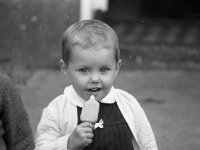 Olivia Cotter, Ballinrobe, September 1977. - Lyons0017057.jpg  Olivia Cotter, Ballinrobe, September 1977. : 1977 Misc, 19770904 Enjoying ice-lollies 1.tif, Ballinrobe, Lyons collection