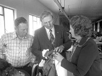 Mr Denis Gallagher Minister for the Gaeltacht visiting the Kenman factory in Geesala. - Lyons0018163.jpg  Mr Denis Gallagher Minister for the Gaeltacht visiting the Kenman factory in Geesala. Peggy and Sonny Mangan showing Denis Gallagher samples of their products. July 1977. : 19770720 Visit to Kenman Factory 1.tif, Belmullet, Lyons collection