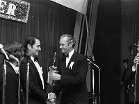 Castlebar International Song Contest 1971 - Lyons0005418.jpg  Castlebar Song Contest 1971. UK composer Vic Dawton (four times winner at Castlebar) receiving his prize for another win from Benson & Hedges director sponsors of the event. At right compere Des Keogh RTE. : Castlebar Song Contest, Dawton, Keogh