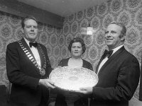 Castlebar Song Contest 1976 - Lyons0005761.jpg  Castlebar Song Contest 1976. Jude Ainsworth at left Chairman of Castlebar UDC and Mrs Ainsworth making a presentation to Joe Malone Director General Bord Failte Eireann. : Ainsworth, Castlebar Song Contest, Malone
