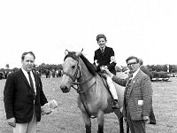 Castlebar Agricultural Show, July 1968. - Lyons0012512.jpg  Young rider receiving his rosette. At left Tom Cunniffe, Castlebar SJI representative .Castlebar Agricultural Show, July 1968. : 19680704 Castlebar Agricultural Show 3.tif, 19680704 Castlebar Show 2.tif, Castlebar, Farmers Journal, Lyons collection