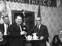 Dinner in the Welcome Inn Hotel, Castlebar. to honour TD Michael - Lyons0012560.jpg  Dinner in the Welcome Inn Hotel, Castlebar. to honour TD Michael O' Morain's thirty years in Dail Eireann, January 1969. Proprietor of the Welcome Inn Tom McHugh at right making a presentation to Michael O'Morain. : 19690122 Michael O' Morain 30 years in the Dail 2.tif, 19690122 Michael O'Morain 30 years in the Dail 2.tif, Castlebar, Lyons collection