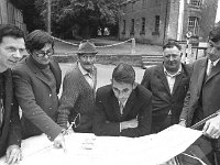 Castlebar Boxing Club, July 1971. - Lyons0012719.jpg  Castlebar Boxing Club, July 1971. Looking at the plans for the new clubhouse.  L-R : Larry Hingerton; John Hamrock, architect; the "Hero" Guthrie; Larry Mc Hale, contractor; Paddy Mc Ginty and Padraig Waslh. : 1971 Misc, 19710721 Castlebar Boxing Club for Going Places 3.tif, Article for "Going Places" page in the Evening Herald, Castlebar, Lyons collection