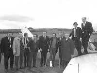 Arrival of Joe Early at Castlebar Airport, December 1971. - Lyons0012748.jpg  Mayo footballer Joe Early after arriving back in Castlebar, greeted by team members and county officials and supporters, December 1971. Included in the photo is Mick Duffy, Westport; Paddy Muldoon, Westport; Johnny Biesty, Ballyhaunis and Ray Prendergast, Castlebar; and Paddy Basquill, Castlebar. : 1971 Misc, 19711216 Arrival of Joe Early at Castlebar Airport 1.tif, Castlebar, Lyons collection