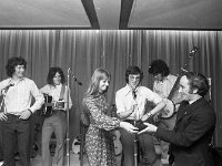 Presentation to Brother Pious September 1972. - Lyons0012801.jpg  Mary Heverin lead singer with the group making a presentation to the former Brother Pious De La Salle on his departure from Castlebar. La Salle had performed their last concert in Breaffy House on that occasion. : 19720928 Presentation to Brother Pious.tif, Castlebar, Lyons collection
