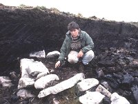 A student carefully excavating on the Ceide fields., July 1989. - Lyons00-20698.jpg  "Roots that go down very deep"; story about Dr Caulfield archaeologist and the restoration project at the Ceide Fields, Keadue, North Mayo by Sonia Kelly. : 19890719 Ceide Fields Keadue County Mayo 7.tif, Ceide Fields, Farmers Journal, Lyons collection