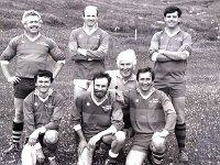 Football match, Clare Island - Lyons0009148.jpg  Clare Isalnd football game: Mayo County Council team. (Neg 8A 9). Kneeling, from left: Ger Munnelly, John Morrissey, Tom Heneghan, Steve Verity. Standing, from left: Tom Feerick, Kieran Shally, Seamus Granaghan.