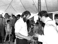 Clare Island school centenary. - Lyons0009162.jpg  Clare Island school centenary. Oliver O' Malley bringing up the gifts at the mass. (Neg 29 29A)