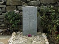 The grave of an English pilot who crashed on Clare Island in World War two. - Lyons0009255.jpg  Clare Island: Graveyard of an English pilot. The grave had been outside the consecrated grounds because he was non-catholic but Fr Ned Crosbie took away the boundary wall and incorporared the grave into the Church yard.