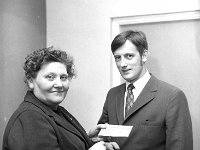 Mayo Community Leaders Group Exhibition in the Town Hall Claremorris, May 1971. - Lyons0013345.jpg  Mrs Maria Cribben, Ballyhaunis with the donation cheque at the Mayo Community Leaders Group Exhibition in the Town Hall Claremorris, May 1971. : 19710513 Mayo Community Leaders Exhibition 8.tif, Claremorris, Lyons collection