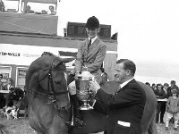 Claremorris Show, August 1972. - Lyons0013381.jpg  Mr Arthur Hanley, Claremorris Show Society presenting the Cup to the winning lady rider and the horse approves of the Cup.  Claremorris Show, August 1972. : 1972 Misc, 19720817 Claremorris Show 7.tif, Claremorris, Lyons collection