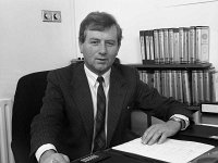 Griffith's Garage, Claremorris, September 1988. - Lyons0013515.jpg  Padraic Floey General Manager at his desk in Griffith's Ford garage Claremorris, September 1988. : 19880903 Griffith's Garage 8.tif, Claremorris, Lyons collection