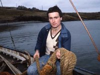 Inishbofin: Deck-hand Martin on Leenane Head ferry.. - Lyons0009313.jpg  Inishbofin: Deck-hand Martin on Leenane Head ferry. : 19880217 Inishbofin 13.tif, Farmers Journal, Lyons collection