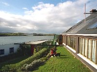 Helma, owner of Inishturk Beag attending her garden, 1999. - Lyons00-20523.jpg  Bob and his wife Helma who owned Inishturk beag, which is just off Cleggan, Kilmeena, Westport. Helma attending her garden. : 1999 Misc, 19990127 Inisturk Beag 1.tif, Lyons collection