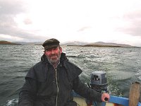 Bob, owner of Inishturk Beag on his boat, 1999. - Lyons00-20524.jpg  Bob and his wife Helma who owned Inishturk beag, which is just off Cleggan, Kilmeena, Westport. Bob on his boat. : 1999 Misc, 19990127 Inisturk Beag 2.tif, Lyons collection