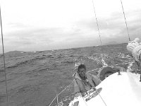 Sailing to Inishturk - Lyons0008836.jpg  Michael Murphy at the helm, sailing to Inishturk.  (Neg 33) : 1984 Inish Turk 1.tif, Inish Turk, Lyons collection