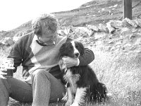 Inishturk:school centenary celebrations.. - Lyons0008879.jpg  Inishturk: Enda Kenny making friends with an island dog on occasion of school centenary celebrations. (Neg 4A 5) : 1986 Inish Turk 41.tif, Inish Turk, Lyons collection