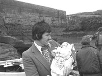 Inishturk: Jack Heanue with his sisters' new born baby - Lyons0008920.jpg  Inishturk: Jack Heanue with his sisters' new born baby arriving back to Inish Turk from the hospital. (Neg 14 12A) : 19811129 Inish Turk 9.tif, Inish Turk, Lyons collection