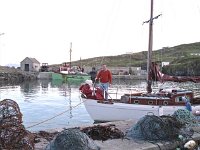 Inishturk: Tom Carter with his brother's Seamus' boat - Lyons0008927.jpg  Inishturk: Tom Carter with his brother's Seamus' boat which he had tied up at Deilia and John Concannon's house. : 19870505 Inishturk 1.tif, Inish Turk, Lyons collection