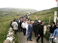 Inishturk: switching on of electricity supply. - Lyons0008940.jpg  Fr Denis Carney and Mr Haughey meeting some of the islanders on his way to turn on the electricity on Inishturk. (Neg 18) : 19870704 Inishturk 7.tif, Inish Turk, Lyons collection