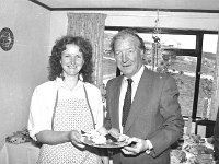 Inishturk: switching on of electricity supply. - Lyons0008947.jpg  Deilia Concannon owner of the Inishturk Restaurant and Guest House giving Mr Haughey his dinner. (Neg 23 23A) : 19870704 Inishturk 14.tif, Inish Turk, Lyons collection