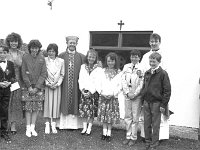 Confirmation on Inishturk. - Lyons0008968.jpg  Confirmation on Inishturk: Standing second from the left Ann-Marie Principal of Inish Turk School with the pupils who were confirmed by Archbishop Cassidy. At right Fr Peter Gannon Parish Priest of Clare Island and Inish turk. (Neg 12A) : 19910617 Confirmation on Inish Turk 14.tif, Inish Turk, Lyons collection