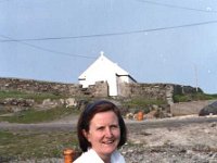 Inishturk: Deilia Concannon. - Lyons0009008.jpg  Inishturk: Deilia Concannon with the island church in the background. (Neg 11) : 19921001 Inish Turk 66.tif, Inish Turk, Lyons collection