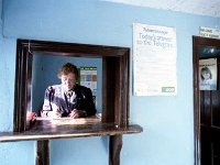 Inishturk: Postmistress Tess at the hatch. - Lyons0009047.jpg  Inishturk: Postmistress Tess at the hatch. (Neg 30) : 199210 Inish Turk 46.tif, 19921002 Inish Turk 46.tif, Inish Turk, Lyons collection