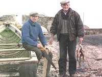 Inishturk: Paddy Faherty bringing some fresh fish to his friend  Inishturk: Paddy Faherty bringing some fresh fish to his friend John Joe.. - Lyons0009060.jpg  Inishturk: Paddy Faherty bringing some fresh fish to his friend John Joe. (Neg 6A 7) : 19921003 Inish Turk 11.tif, Inish Turk, Lyons collection