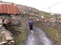 Mary Joe Prendergast walking on Inishturk. - Lyons0009071.jpg  Mary Joe Prendergast walking on Inishturk. (Neg 25A 26) : 19921004 Inish Turk 7.tif, Inish Turk, Lyons collection