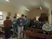 Inishturk: Tess disributing Holy Communion. - Lyons0009077.jpg  Inishturk: Tess disributing Holy Communion. The priest goes to the island usually once a monthe, so they only have mass then. (Neg 18A) : 19921004 Inish Turk 13.tif, Inish Turk, Lyons collection