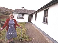 Inishturk: Katie Heanue outside her house. - Lyons0009092.jpg  Inishturk: Katie Heanue outside her house. (Neg 28) : 19921005 Inish Turk 55.tif, Inish Turk, Lyons collection