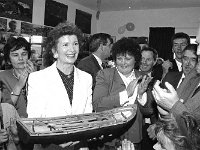 Visit of President MAry Robinson to Inishturk - Lyons0009098.jpg  Inishturk: A gift for President Mary Robinson. The President was very pleased with the model currach which was presented by the Inishturk community. Included in the photo is Mary Catherine Heanue, Inishturk; Michael Ring TD, Westport and Mary Robinson's husband Nick. : 19930521 President Mary Robinson's visit 2.tif, Inish Turk, Lyons collection