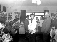 Visit of President MAry Robinson to Inishturk - Lyons0009113.jpg  Inishturk school band performing for President Mary Robinson. On the wall is an exhibition of a day in the life of Inishturk which was photographed  by Liam Lyons in 1992. (Neg 3A) : 19930521 President Mary Robinson's visit 26.tif, Inish Turk, Lyons collection