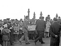 Kiltimagh Graveyard, February 1974. - Lyons0018046.jpg  The tragic scenes in Kiltimagh graveyard where a mother and three children lost their lives in a tragic accident at Westport Quay. February 1974. : 1974, 1974 Misc, 19740207, 19740207 Kiltimagh Graveyard 2.tif, 2.tif, collection, Graveyard, Kiltimagh, Lyons, Lyons collection, Misc