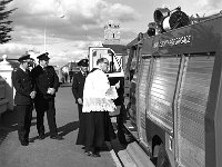 Knock Shrine, 1979. - Lyons00-21113.jpg  Monsignor James Horan blessing Mayo Firebrigade tender before the Pope's visit. Standing at left Chief Fire Officer Tom Ruddy. Also in the photo Austin Gannon Deputy Fire Chief. : 19791002 Blessing Mayo Fire Brigade.tif, Knock Shrine, Lyons collection