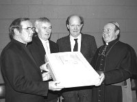 Knock Shrine, 1989. - Lyons00-21192.jpg  Announcement of winning architects for the Reconciliation Church in Knock. At left Mnsgr Dominic Greally Knock. At right Archbishop Joseph Cassidy Tuam. Centre winning architects. (Der  & Moore Architects?) : 19890107 Announcement of winning architects 1.tif, Knock Shrine, Lyons collection