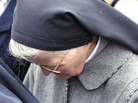 Knock Shrine, 1994. - Lyons00-21279.jpg  Deep in prayer at the National Novena in Knock. : 19940814 National Novena 14.tif, Knock Shrine, Lyons collection