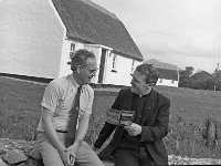 Fr Kieran Waldron, Louisburgh Holiday homes Ltd - Lyons0018241.jpg  Fr Kieran Waldron, Louisburgh Holiday homes Ltd discussing their new broschure with Tom Murphy, Marketing Manager Shannon Development, September 1980. : 198009 Louisburgh Holiday Cottages 1.tif, Louisburgh, Lyons collection